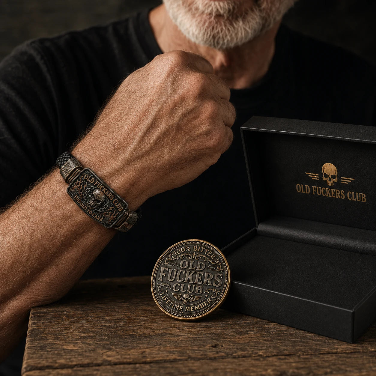 Older man smiling while receiving the Old Fuckers Club bracelet and coin gift set
